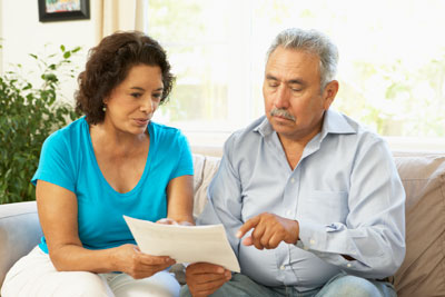 Hispanic couple looking at paperwork